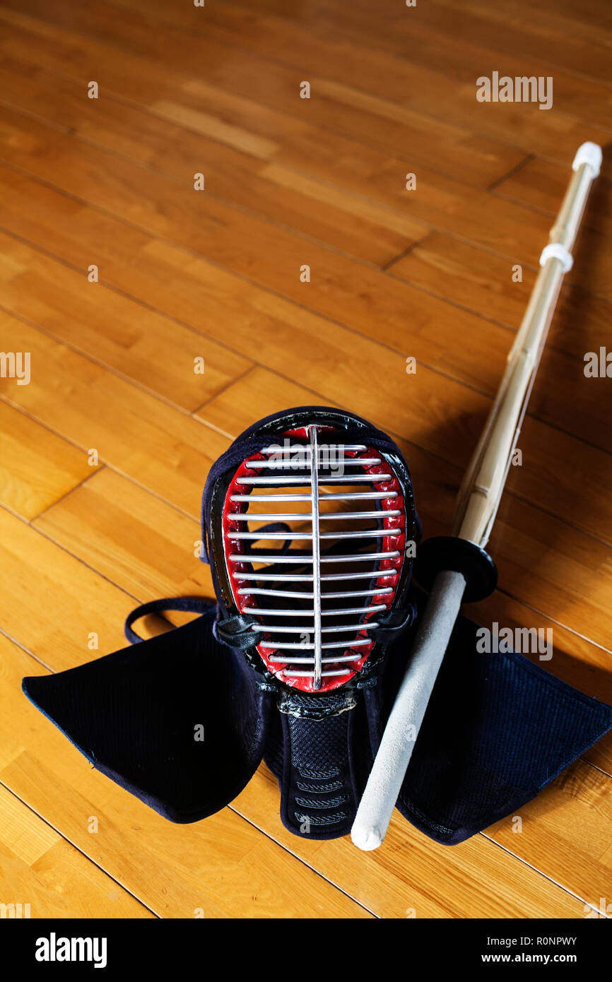 High angle close up of Kendo mask and wood sword on hardwood floor Stock  Photo - Alamy