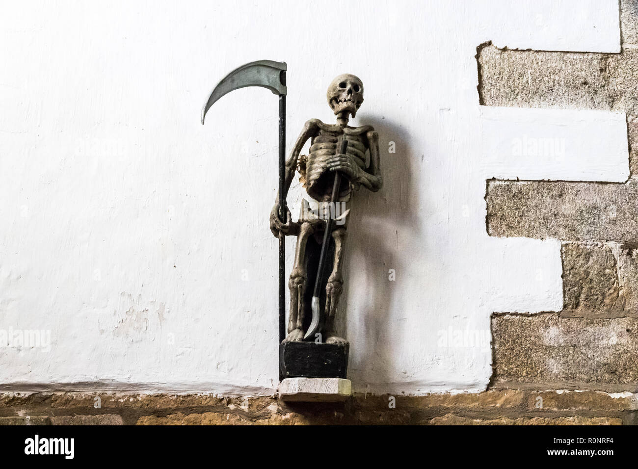 Ploumilliau, France. Statue of the Ankou, a 16th century personification of  death at the Church of Saint Milliau Stock Photo - Alamy