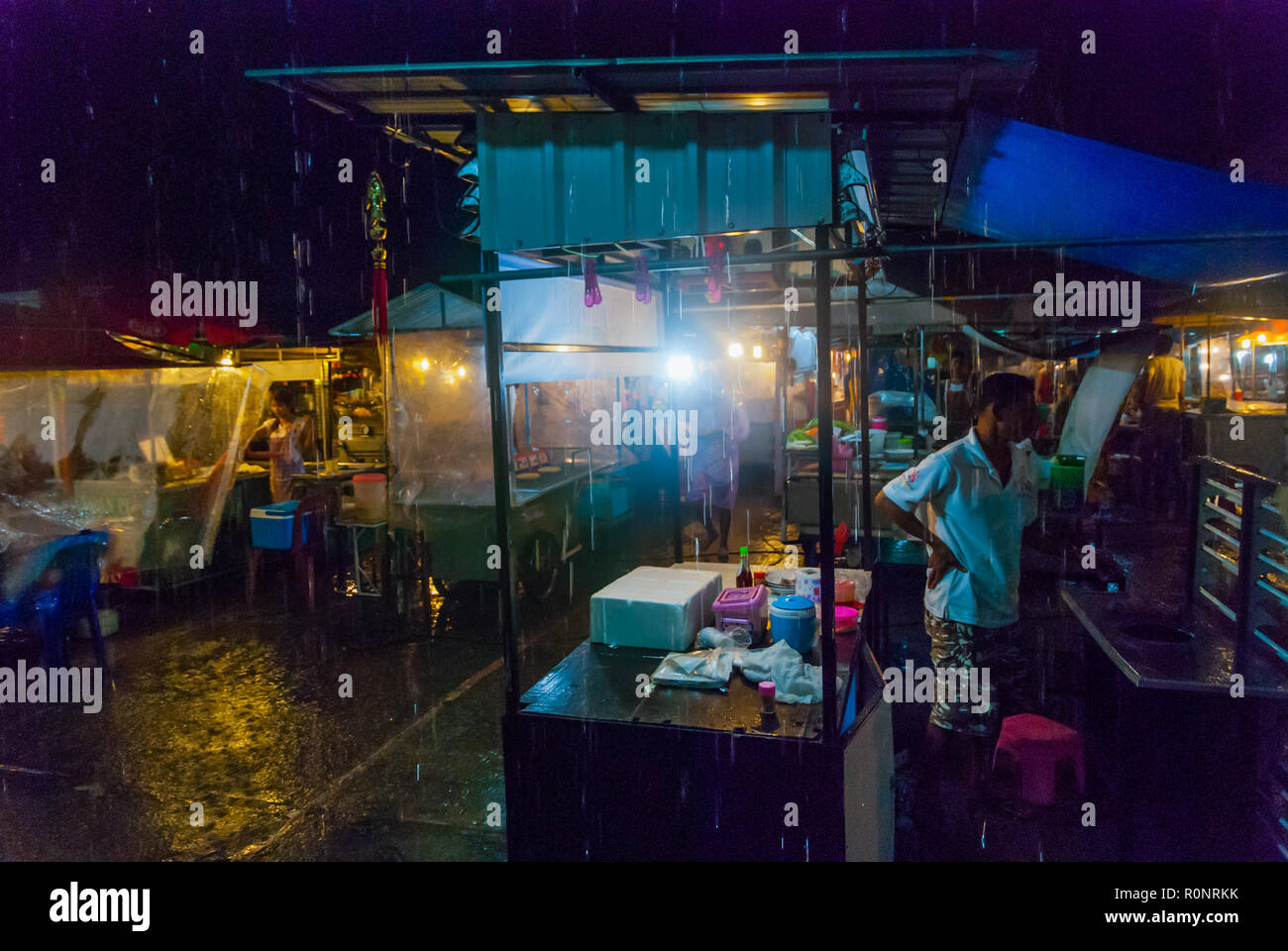 Koh Phangan, Thailand - Sep 2015: Food stalls in local night market during a storm in Koh Phangan island Stock Photo