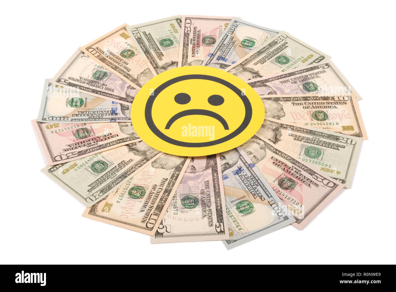 Yellow sad smile faces on mandala kaleidoscope from money. Abstract money background raster pattern repeat mandala circle. Stock Photo