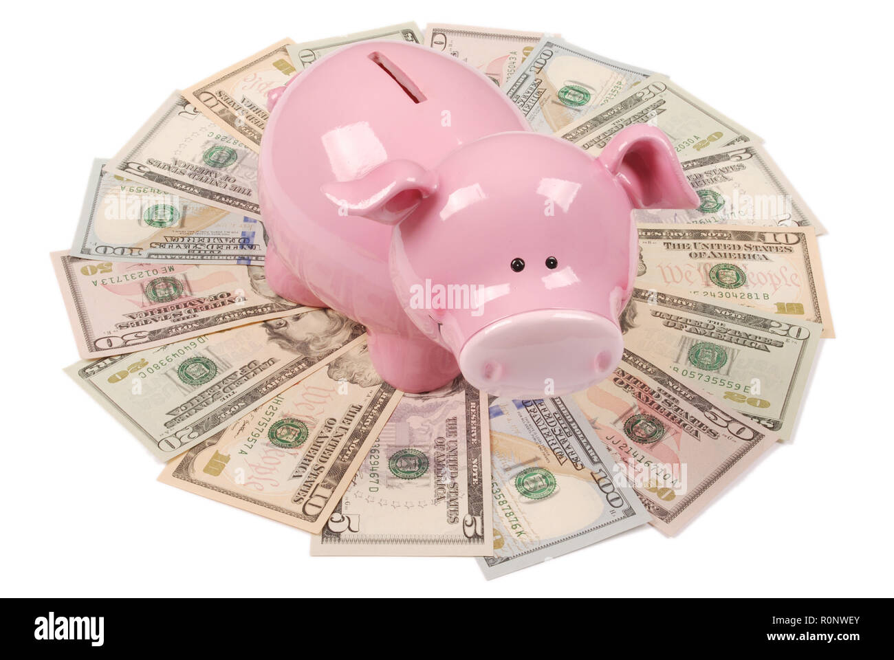 Pink piggy bank on white backgrounds on mandala kaleidoscope from money. Abstract money background raster pattern repeat mandala circle. Stock Photo