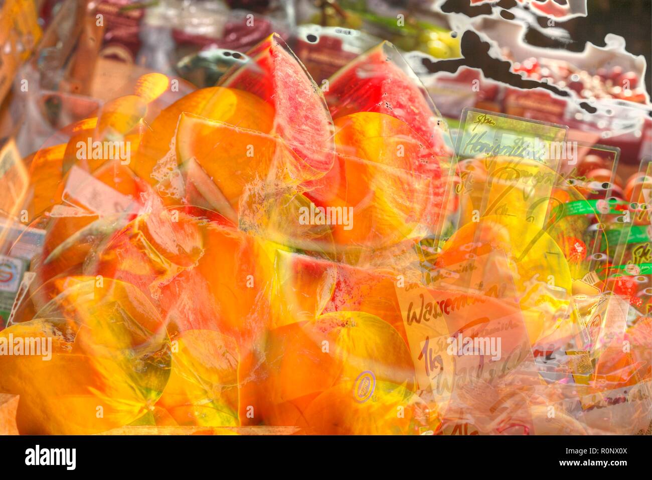 Fresh honey and watermelons on a market stall, Bremen, Germany, Europe   I  Frische Honig- und  Wassermelonen auf einem Marktstand, Bremen, Deutschlan Stock Photo