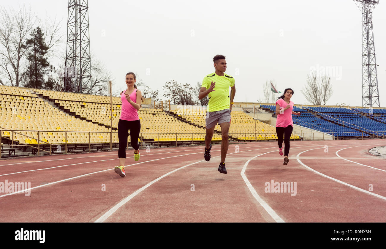 Runner running on ground Stock Photo