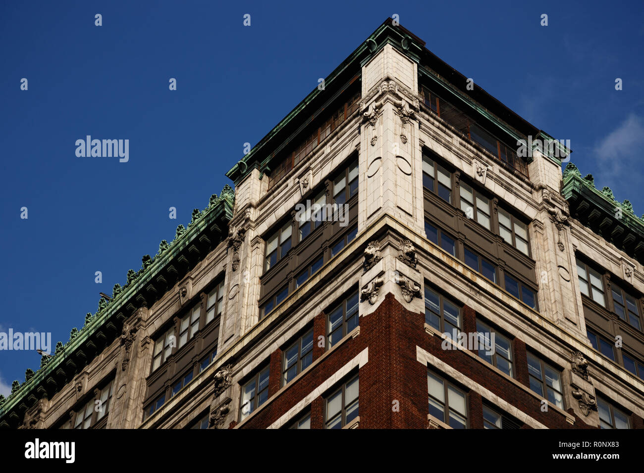 Corner Of An Old Style Building With Decorative Plaques Brackets