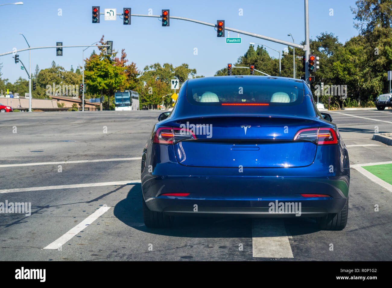 October 19, 2018 Palo Alto / CA / USA - Tesla Model 3 stopped at a traffic light Stock Photo