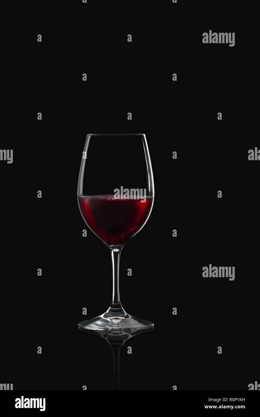 Glass of red wine on a black background Stock Photo