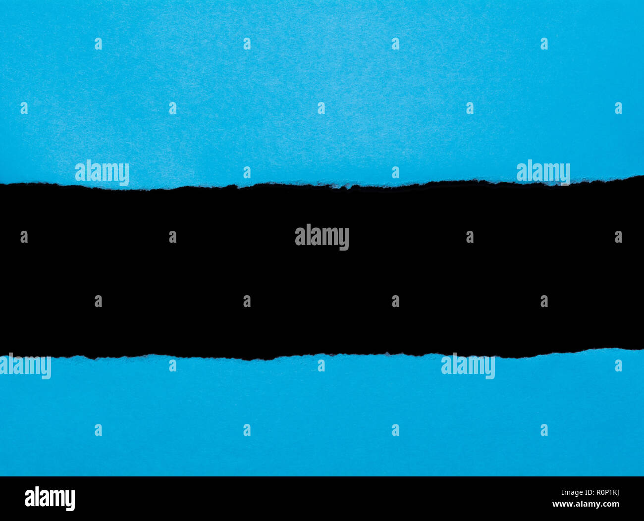 Blue torn paper with opening black space for text. Paper scroll background. Stock Photo