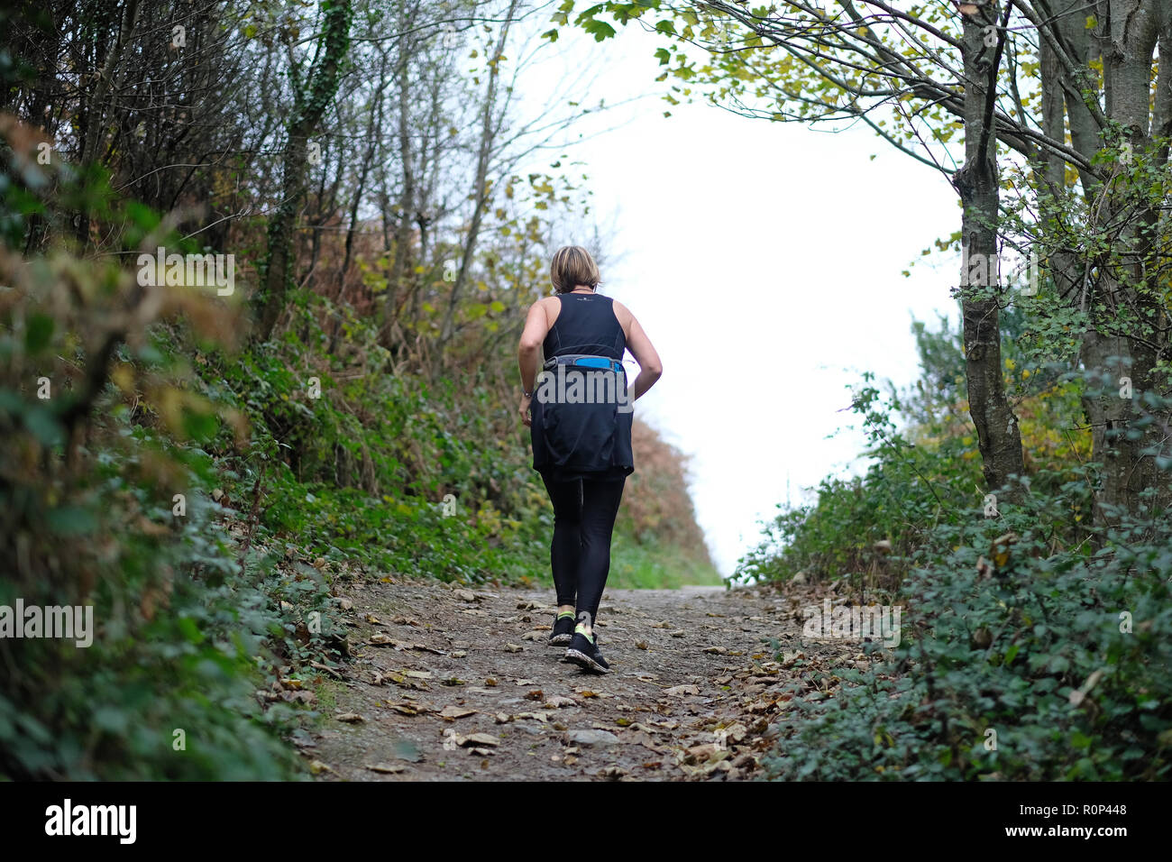 A female jogger in the countryside Stock Photo