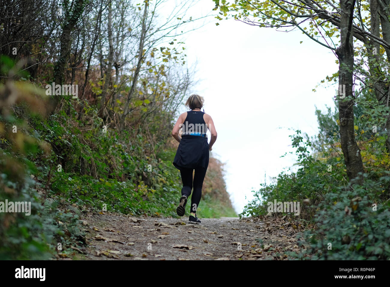 A female jogger in the countryside Stock Photo