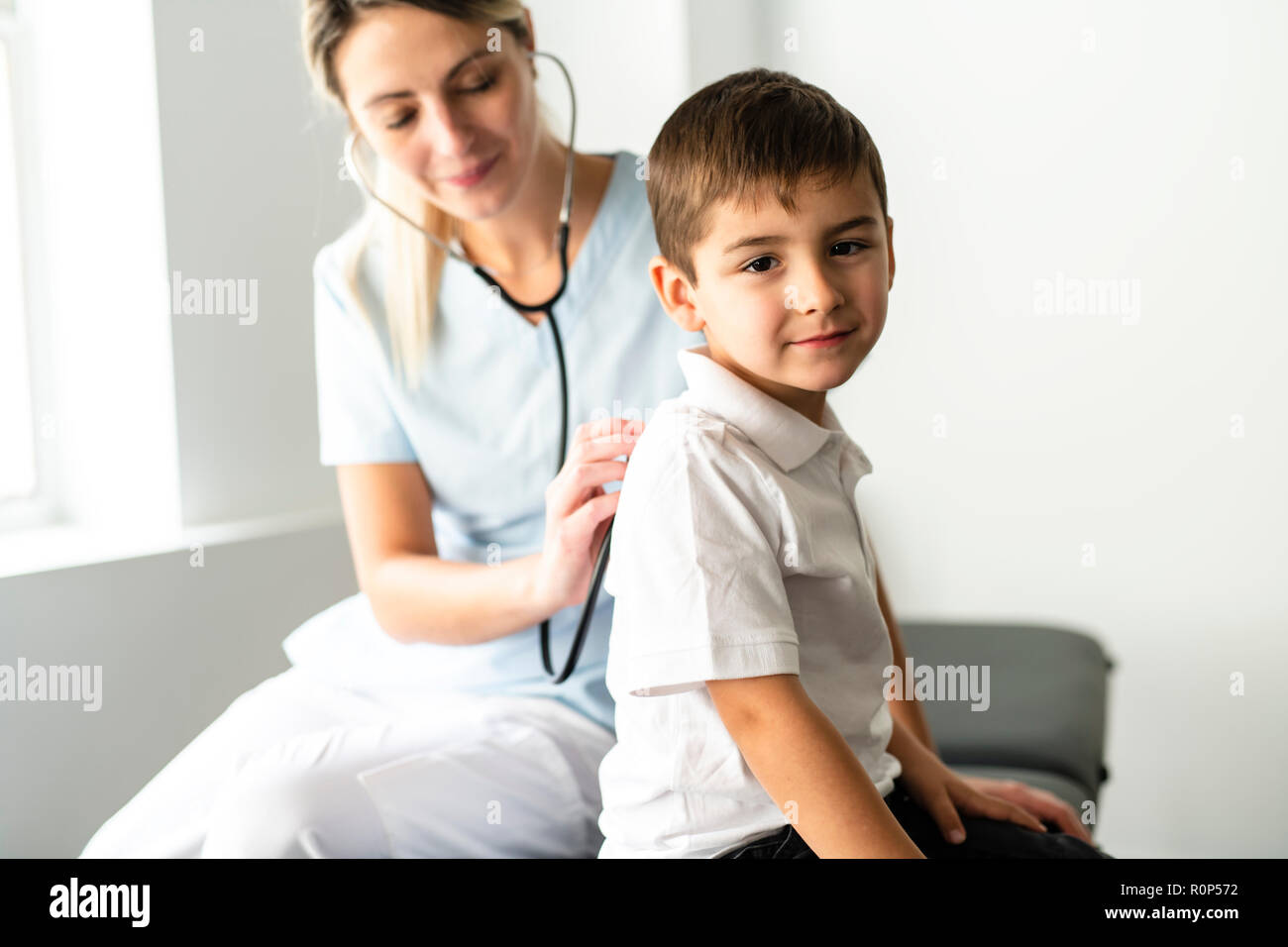 A cute Child Patient Visiting Doctor's Office Stock Photo