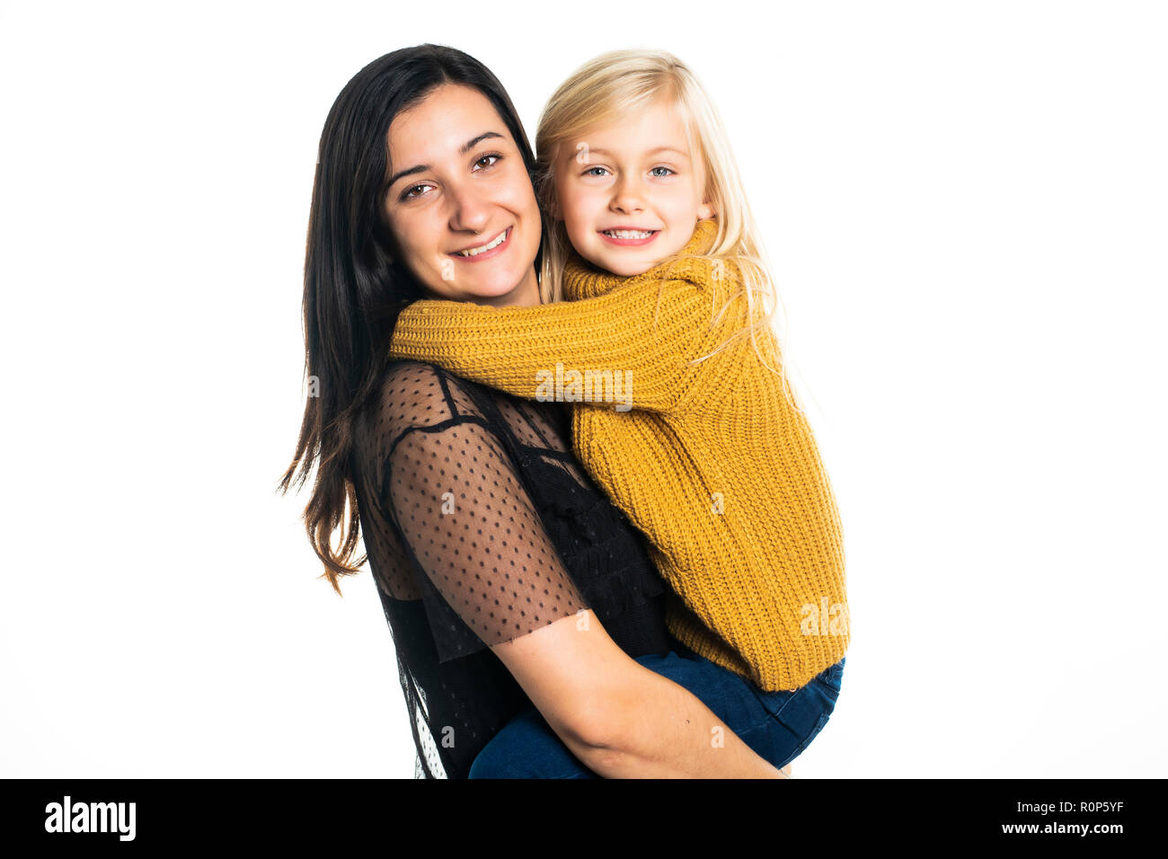 A mother and daughter on studio white background Stock Photo - Alamy