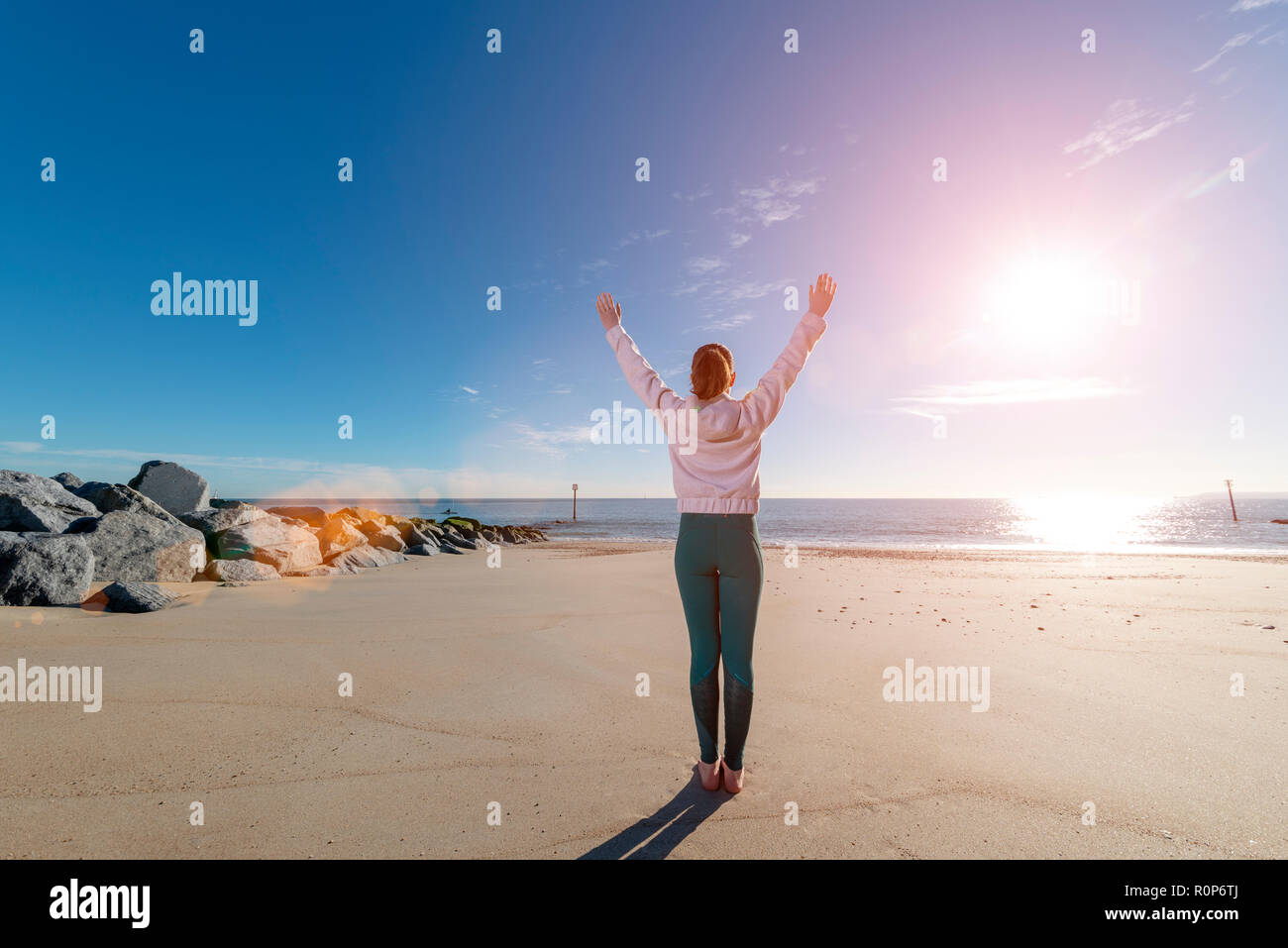 Woman arms outstretched sun hi-res stock photography and images - Alamy