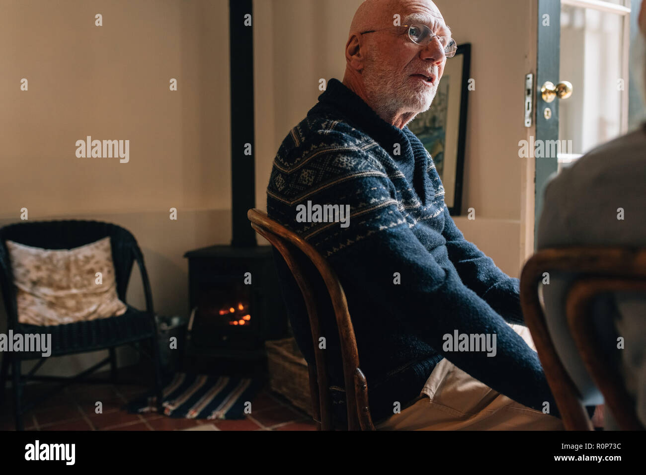 Old man sitting on chair hi-res stock photography and images - Alamy
