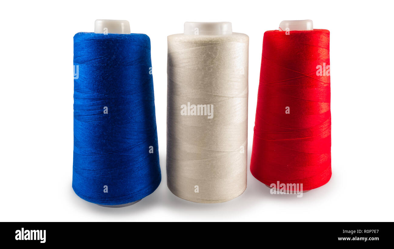 Spools of sewing threads on white background Stock Photo - Alamy