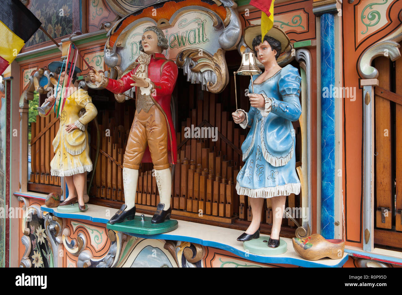 A Dutch street organ with carved figures and a decorated enclosure playing book music at Hawes Carnival Stock Photo