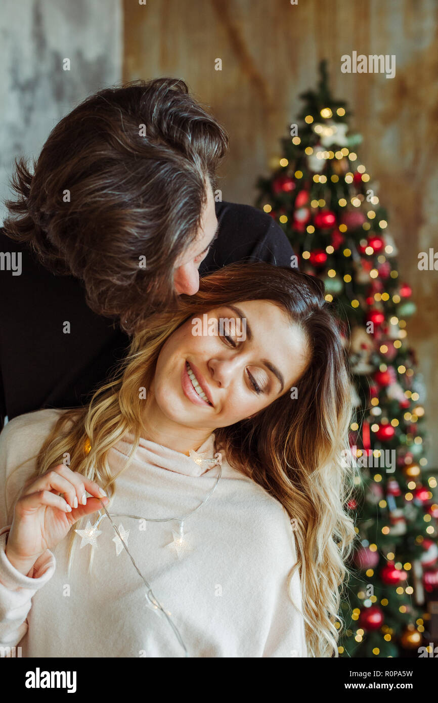 Happy couple in love christmas indoor closeup portrait Stock Photo
