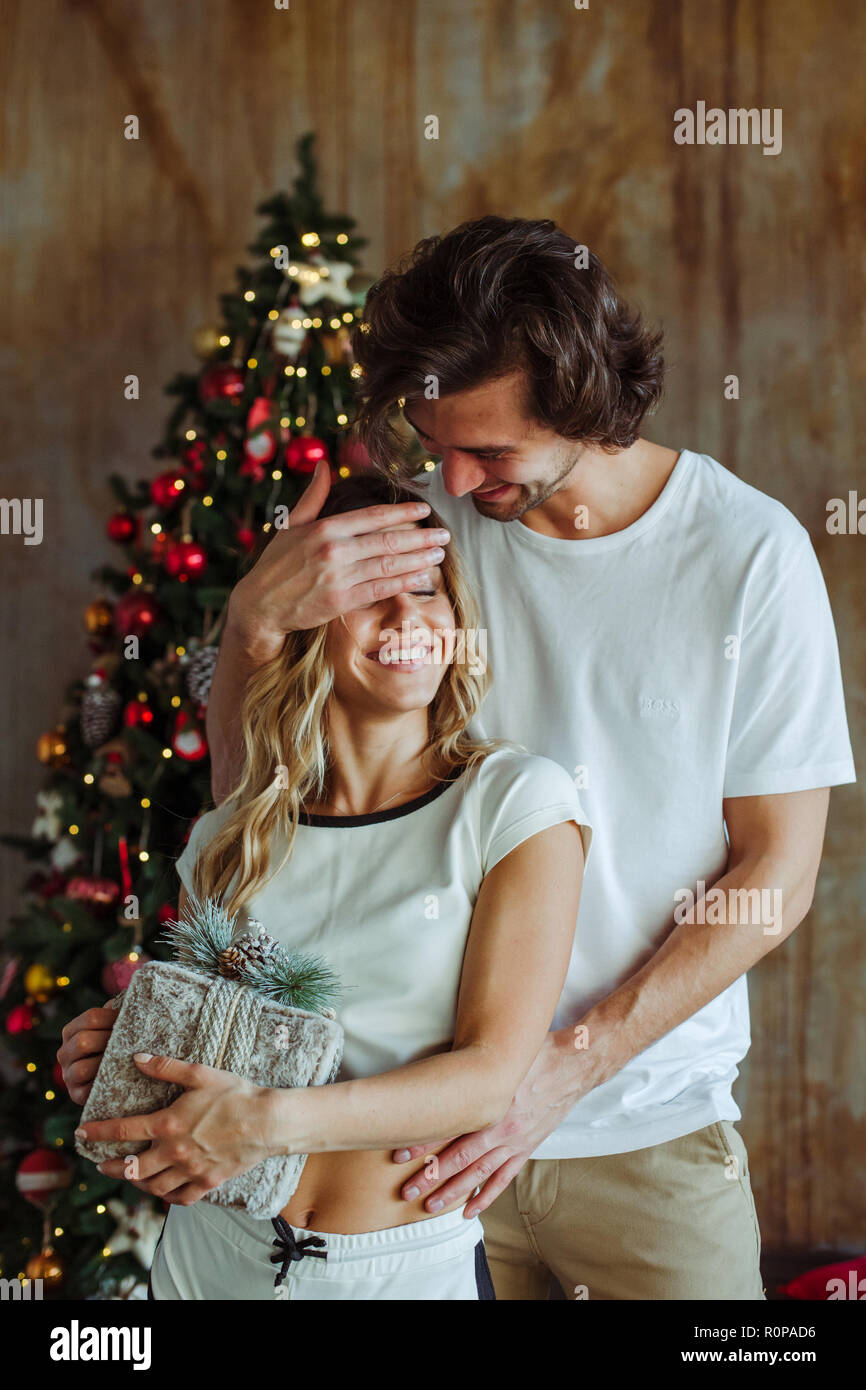 Couple celebrating Christmas at home Stock Photo