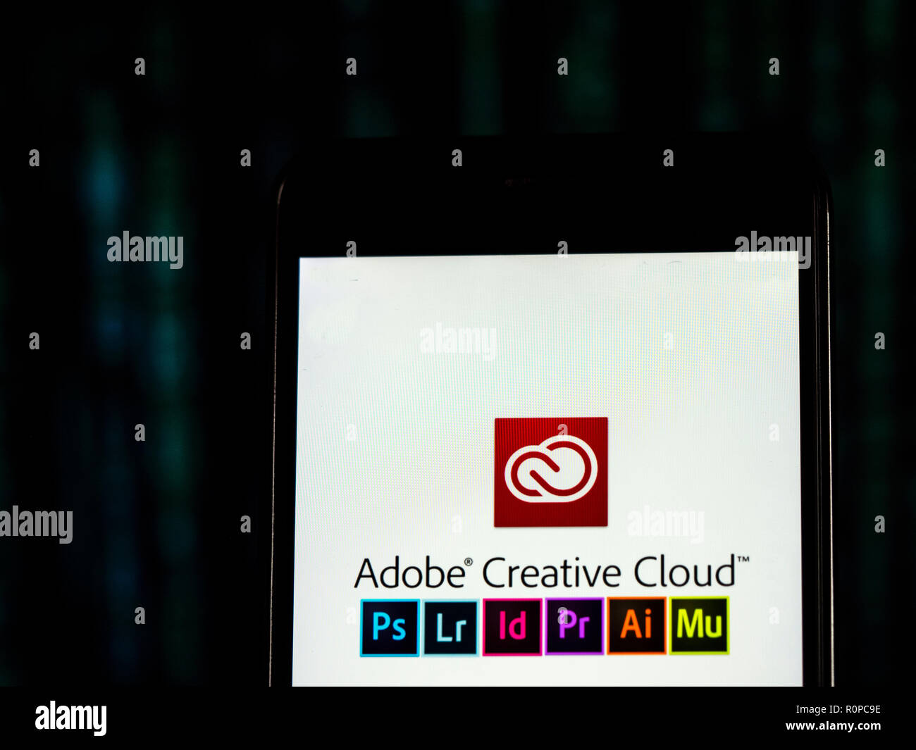 Adobe Creative Cloud logo seen displayed on smart phone. Adobe Creative Cloud is a set of applications and services from Adobe Systems that gives subscribers access to a collection of software used for graphic design, video editing, web development, photography, along with a set of mobile applications and also some optional cloud services. Stock Photo