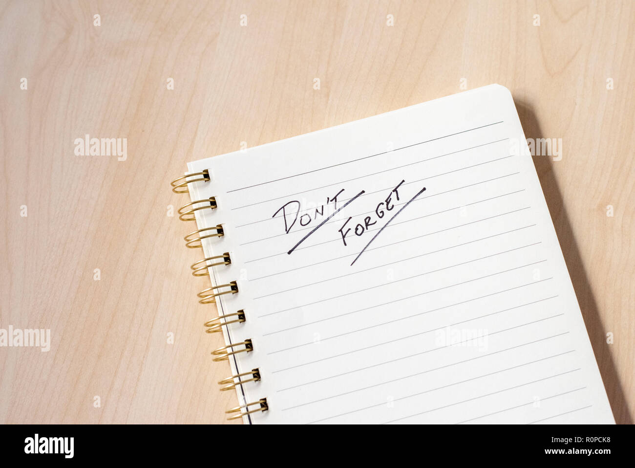white notebook for ideas with notes and wooden desk Stock