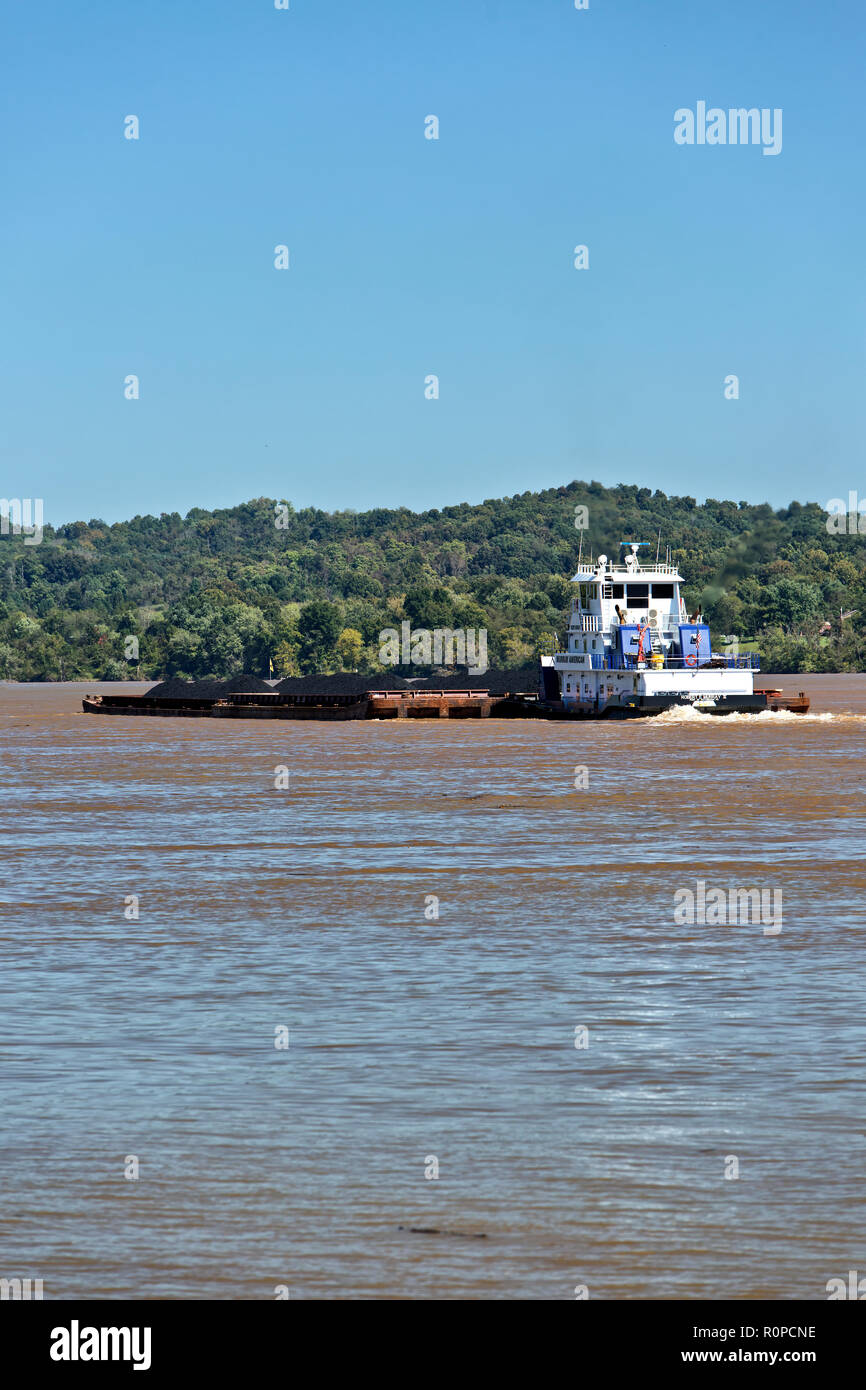 Tugboat pushing loaded coal barges upriver,  Ohio River. Stock Photo
