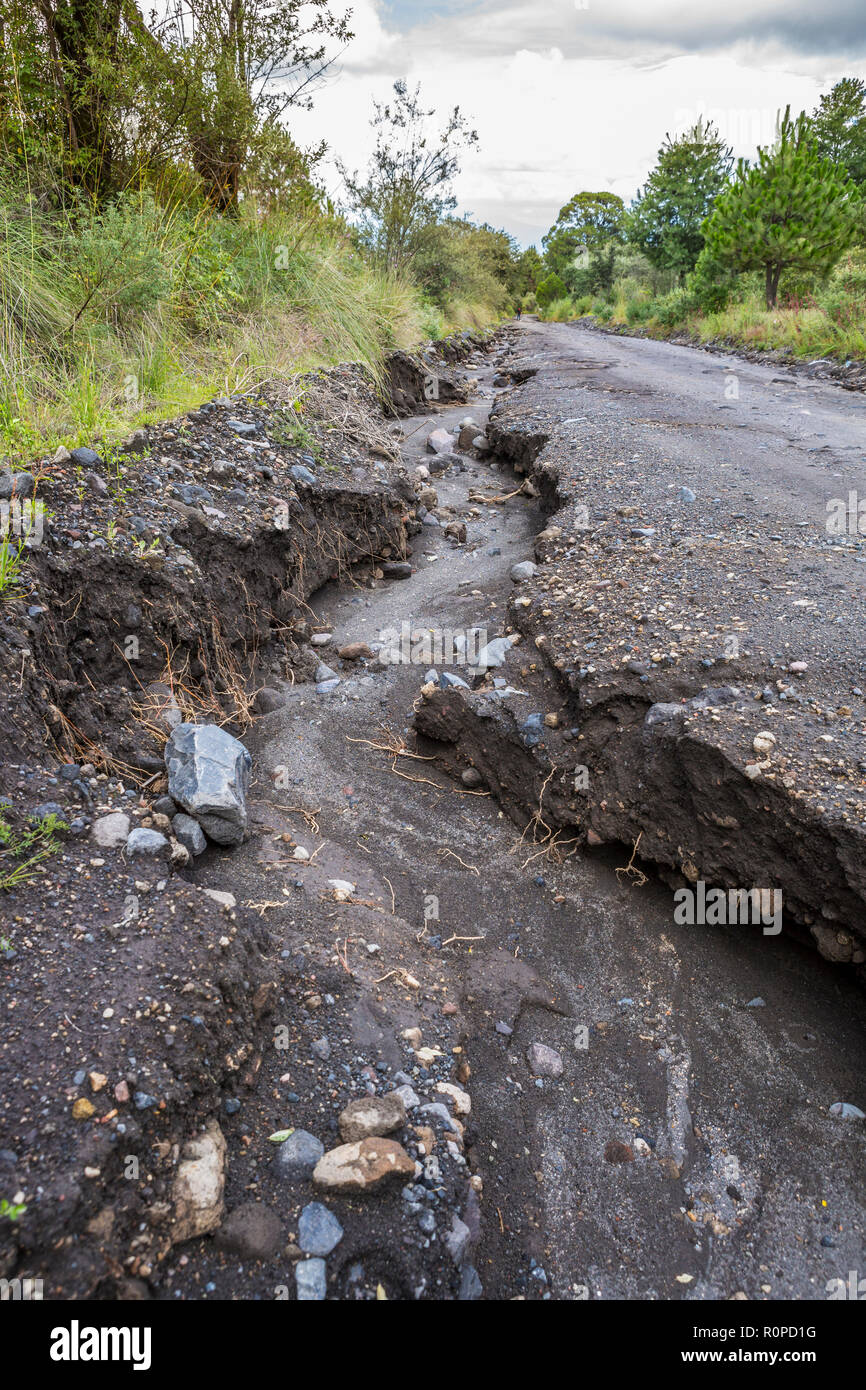 Washed away soil of volcanic dirt track after heavy rainfall, Iztaccihuatl Popocatepetl National Park, Mexico, North America Stock Photo