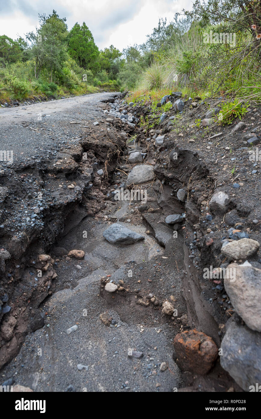 Washed away soil of volcanic dirt track after heavy rainfall, Iztaccihuatl Popocatepetl National Park, Mexico, North America Stock Photo