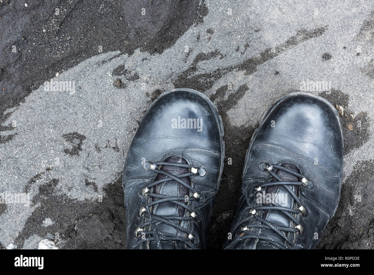 Two black walking boots standing on volcanic soil, Paso de Cortes, Iztaccihuatl Popocatepetl National Park, Mexico, North America Stock Photo