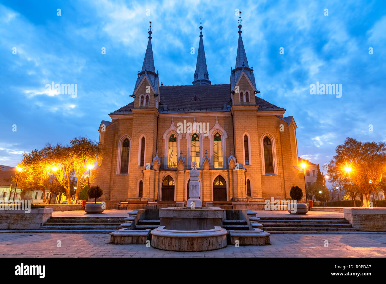 Christian reformed church illuminated at blue hour, in Maramures region, Sighetu Marmatiei Stock Photo