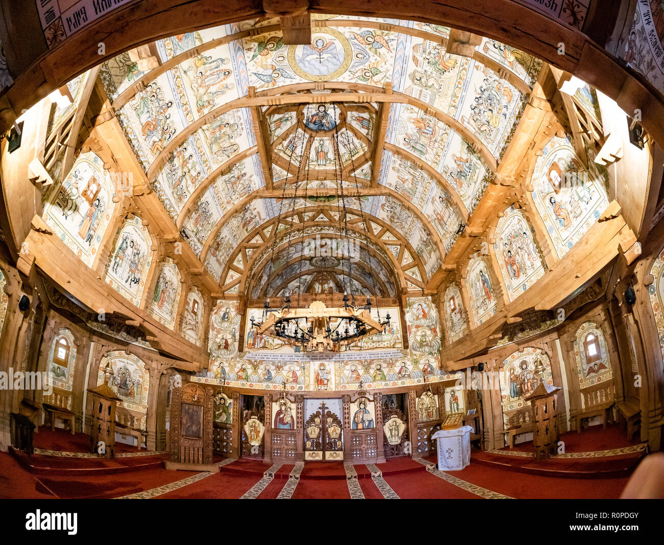 Wide view of Barsana monastery inside the church, with traditional Christian icons painting, in Maramures region, Romania Stock Photo