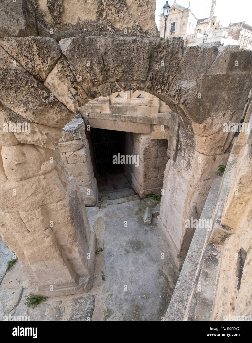 Remains of Roman amphitheatre in Piazza Sant'Oronzo, in the centre of the historic city of Lecce, Puglia, Southern Italy. Stock Photo