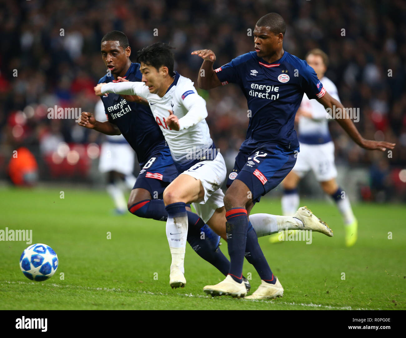 London, England, 06th November 2018.  Tottenham Hotspur's Son Heung-Min go through Pablo Rosario of PSV Eindhoven and Denzel Dumfries of PSV Eindhoven during Champion League Group B between Tottenham Hotspur and PSV Eindhoven at Wembley stadium , London, England on 06 Nov 2018. Credit Action Foto Sport  FA Premier League and Football League images are subject to DataCo Licence. Editorial use ONLY. No print sales. No personal use sales. NO UNPAID USE Credit: Action Foto Sport/Alamy Live News Stock Photo