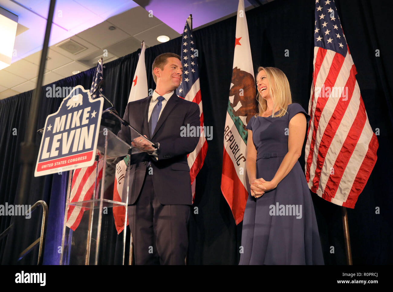 Del Mar, California, USA. 7th Nov, 2018. November 6, 2018 Del Mar, California | Congressional candidate Mike Levin looks to his wife Chrissy as he speaks at his victory rally at the Hilton Hotel in Del Mar, CA.  | Photo Credit: Photo by Charlie Neuman Credit: Charlie Neuman/ZUMA Wire/Alamy Live News Stock Photo