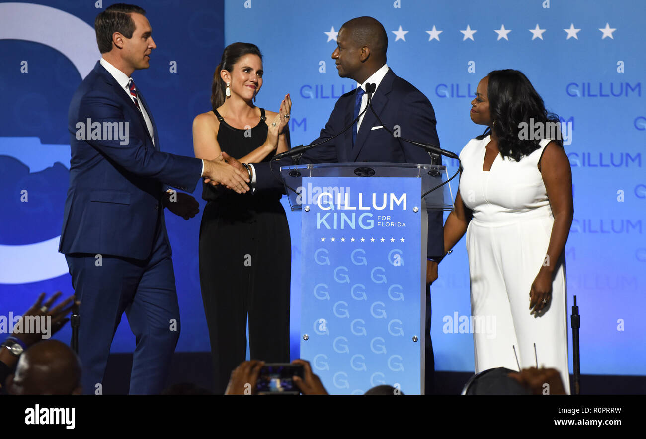 Tallahassee, Florida, USA. 6th November, 2018. Florida Democratic gubernatorial nominee Andrew Gillum shakes hands with his running mate, Chris King, after delivering his concession speech before supporters at an election night event on November 6, 2018 on the campus of Florida A&M University in Tallahassee, Florida. Looking on is Gillum's wife, R. Jai Gillum (R), and Kristen Gillum, the wife of Gillum's running mate. Gillum was defeated by Republican Ron DeSantis. (Paul Hennessy/Alamy) Credit: Paul Hennessy/Alamy Live News Stock Photo