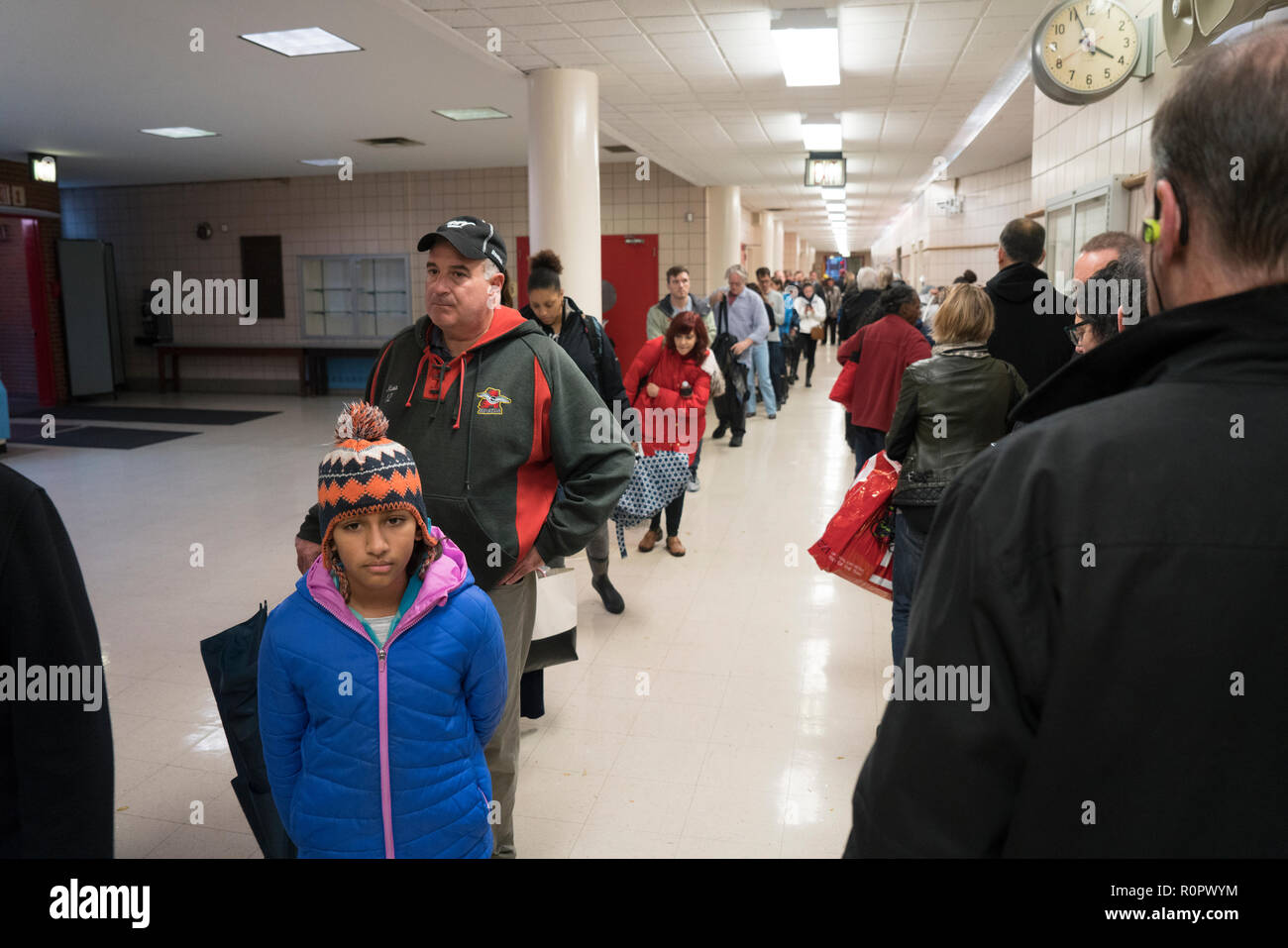 New York, NY, 6th Nov., 2018 — People waited in line to vote at a public school in Tribeca on Nov. 6, 2018. Credit: Terese Loeb Kreuzer/Alamy News Stock Photo
