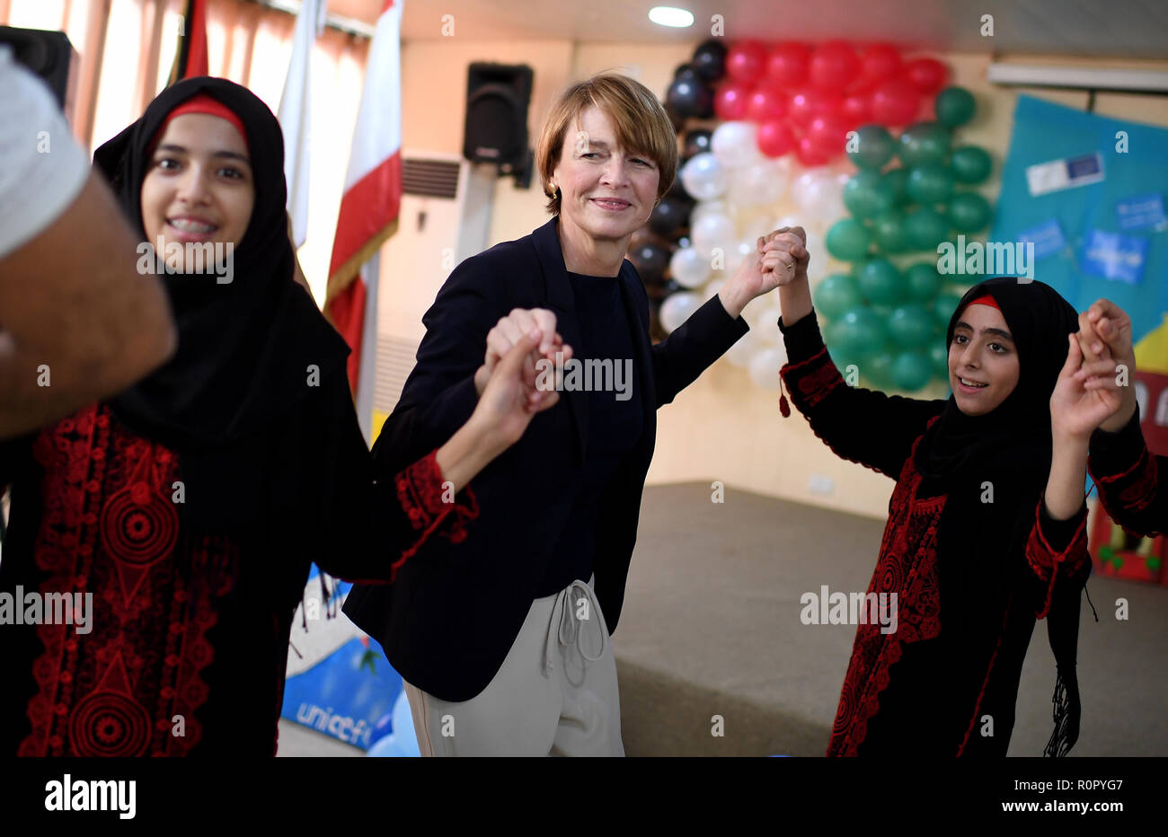 Bourj Al Brajneh, Lebanon. 31st Oct, 2018. Elke Büdenbender, wife of the Federal President, dances a traditional dance with Palestinian youths in the Palestinian refugee camp Bourj Al Brajneh. As patron of UNICEF, she visits aid projects, educational institutions and meets refugees from Syria. Credit: Britta Pedersen/dpa-Zentralbild/ZB/dpa/Alamy Live News Stock Photo