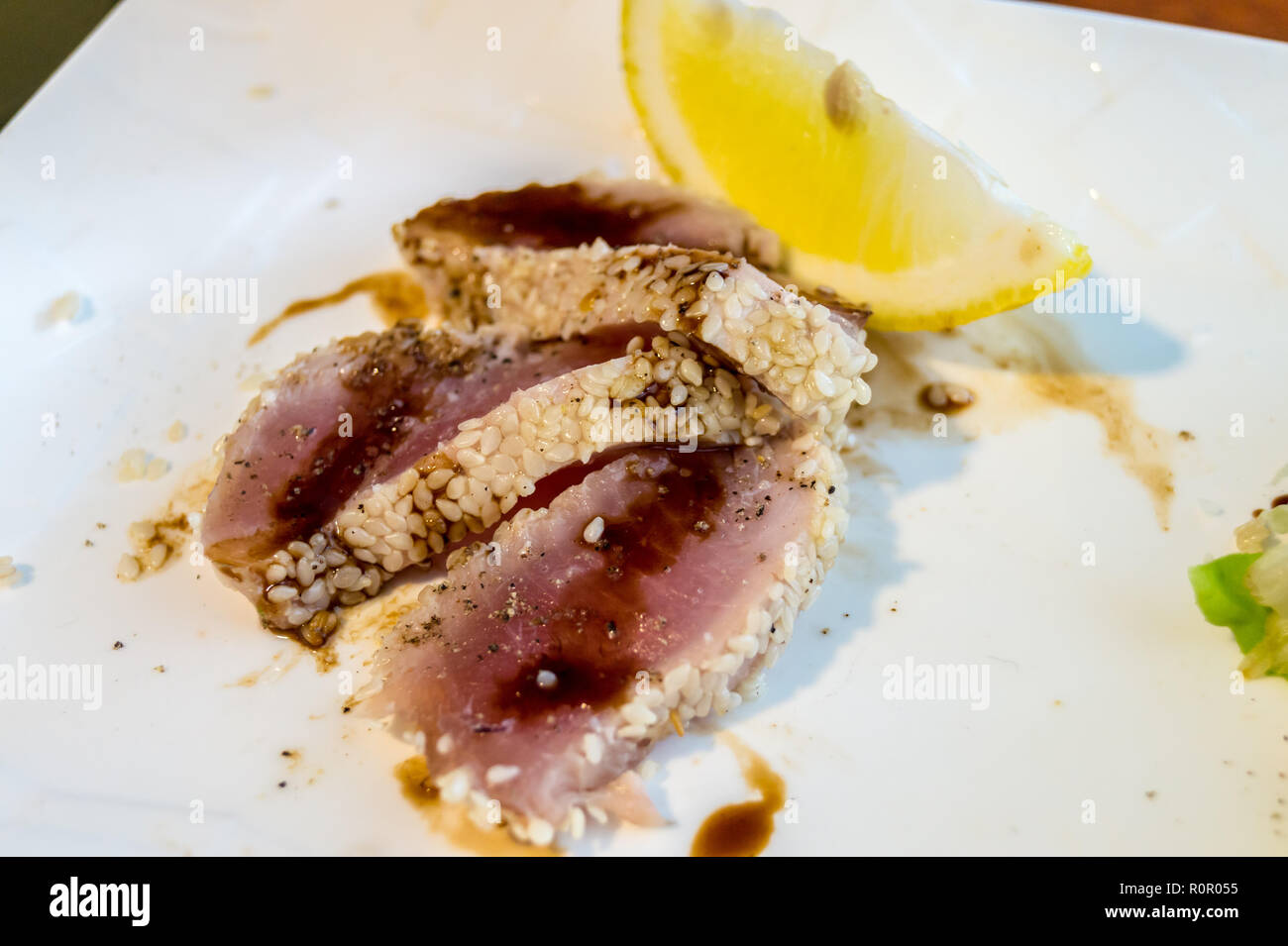 Tuna steak  in soya sauce with sesame seeds, (pave de thon au sesame) Restaurant Attila, Victor Hugo market, Toulouse, Occitanie, France Stock Photo