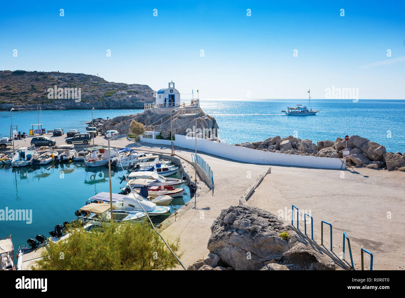 Ship sails off harbour in Kolymbia (Rhodes, Greece) Stock Photo