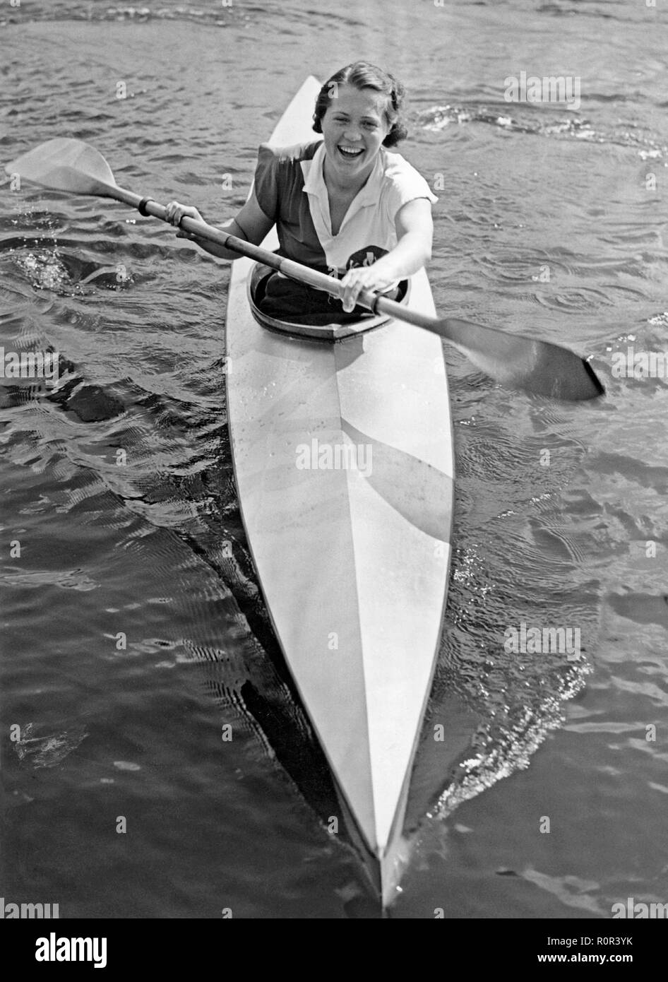 Woman paddling kayak Black and White Stock Photos & Images Alamy