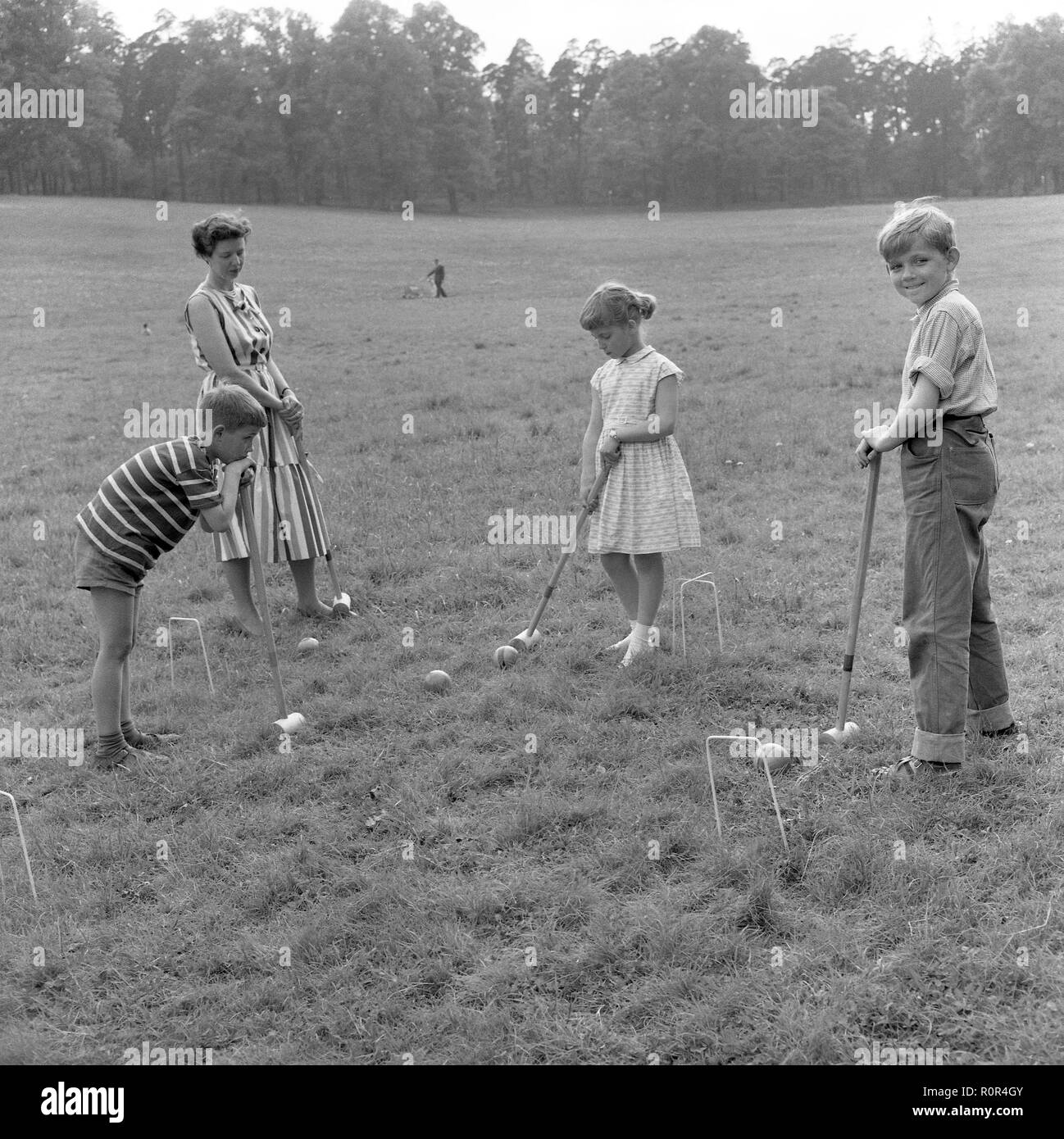 Young boy playing croquet Black and White Stock Photos & Images Alamy