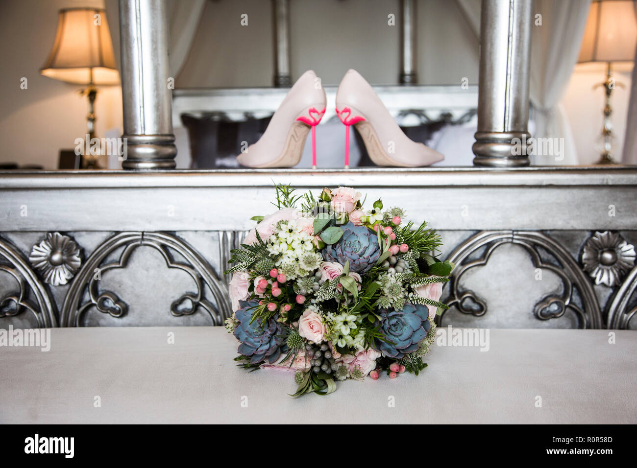 wedding day brides shoes with flamingo heels on them Stock Photo
