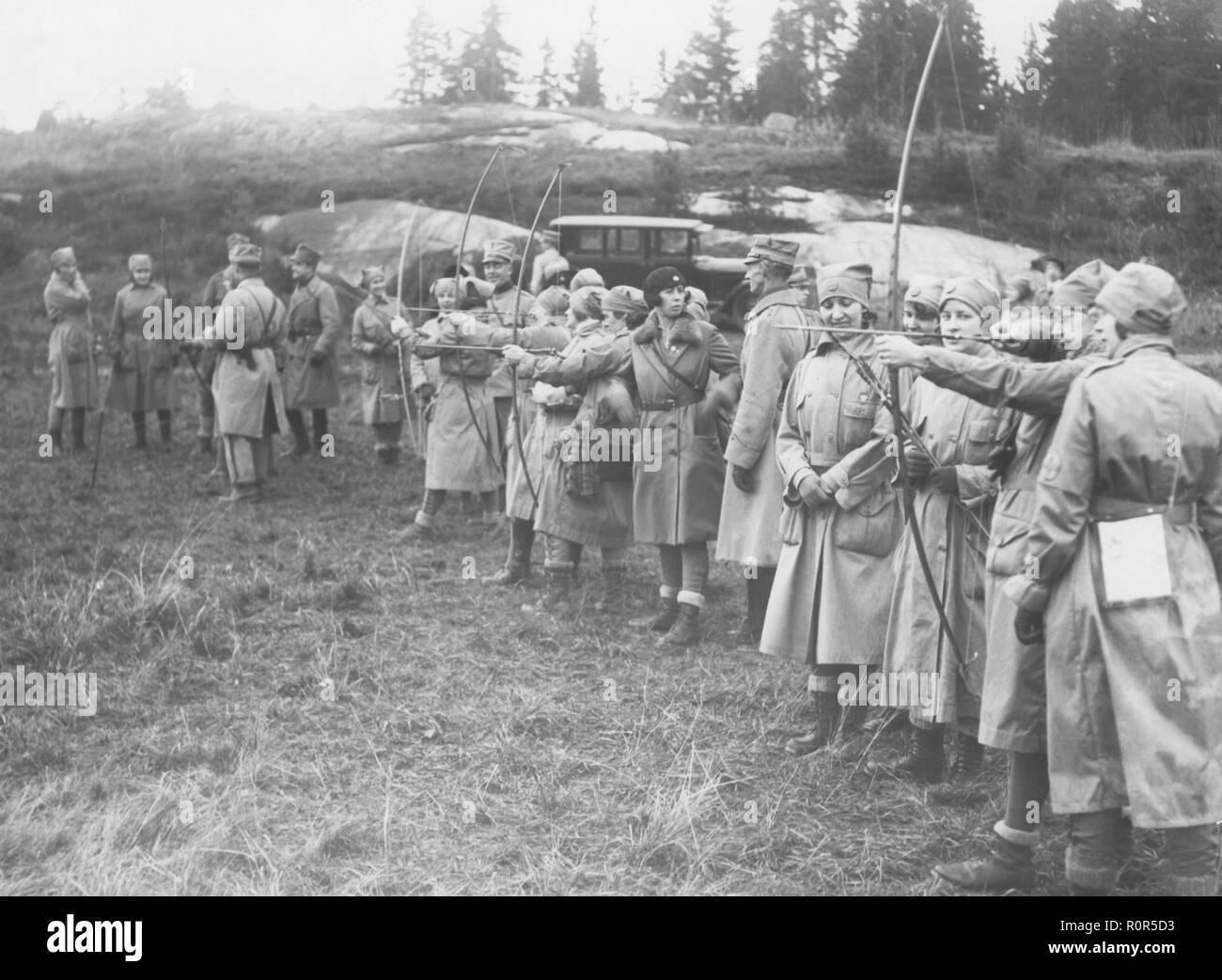 Archery in the 1920s. A group of women from the volenteer military organisation Lottorna is competing in archery. Sweden 1920s Stock Photo