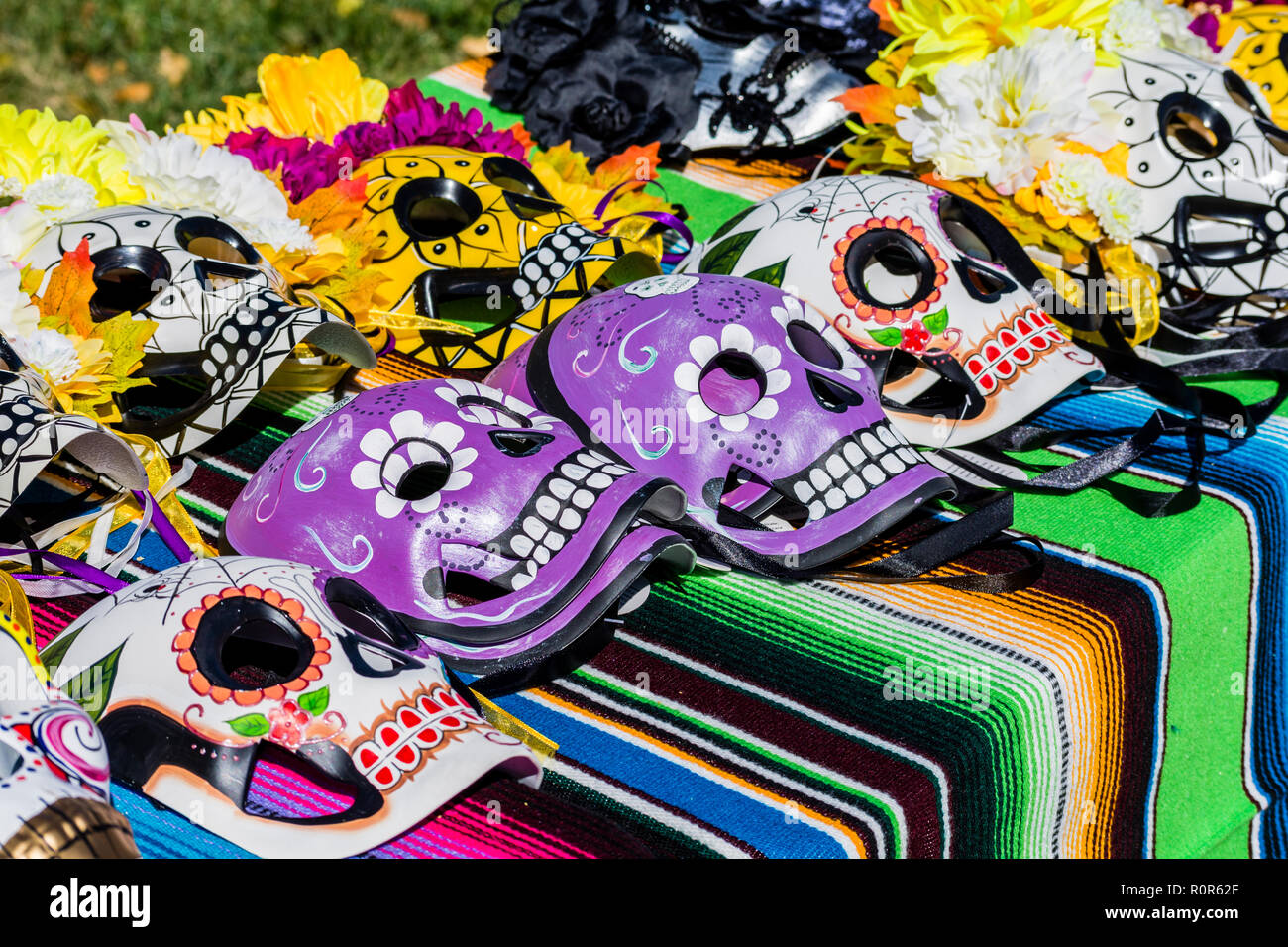 Day of the Dead, Dia de los Muertos, colorful skull masks for sale during celebration in New Mexico USA. Stock Photo