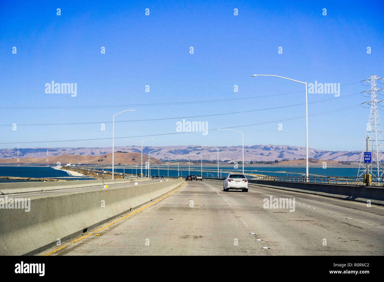 Travelling on Dumbarton bridge towards east San Francisco bay area, Silicon Valley, California Stock Photo