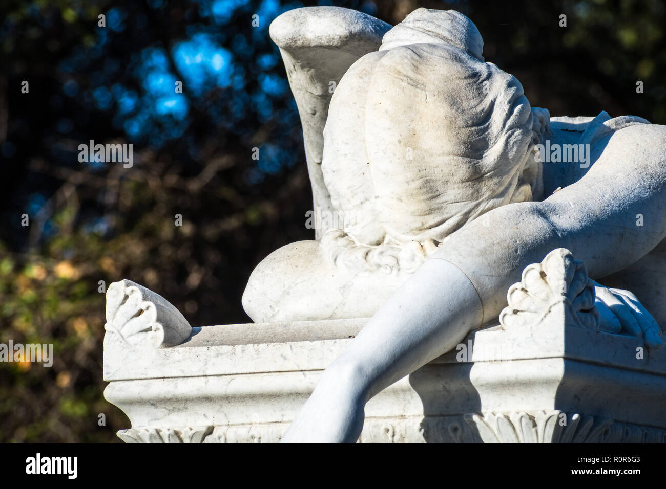 Detail of Weeping angel marble statue located in a public park Stock Photo