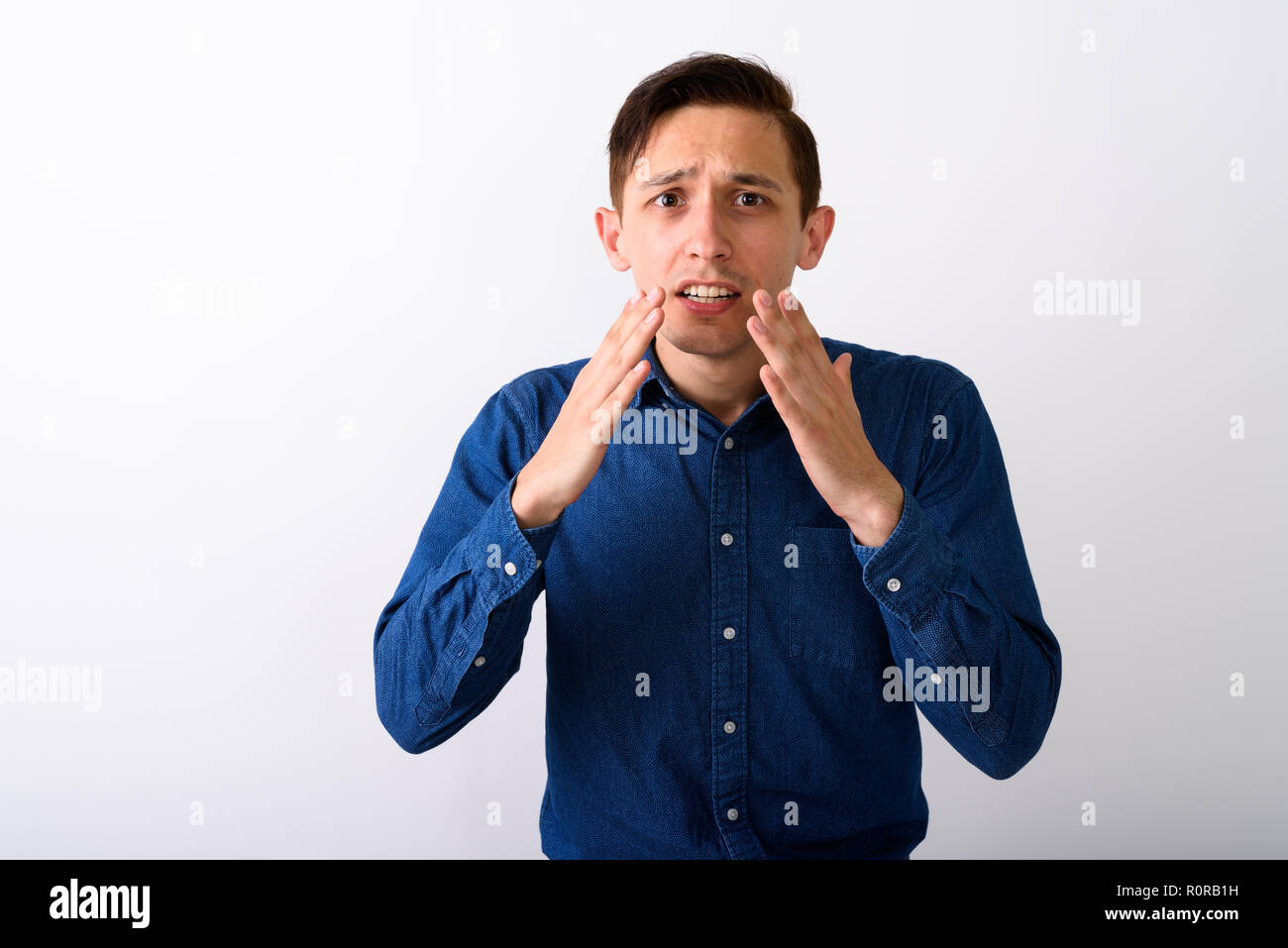 Worried shocked young man hi-res stock photography and images - Alamy