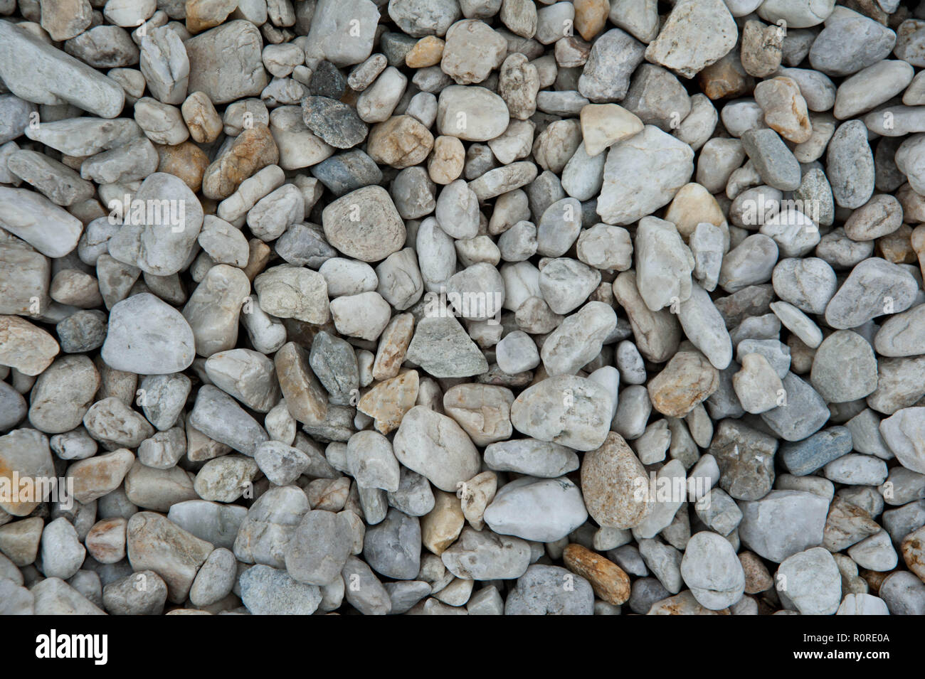 Stone pebbles white and gray gravel texture background for decoration. Stock Photo