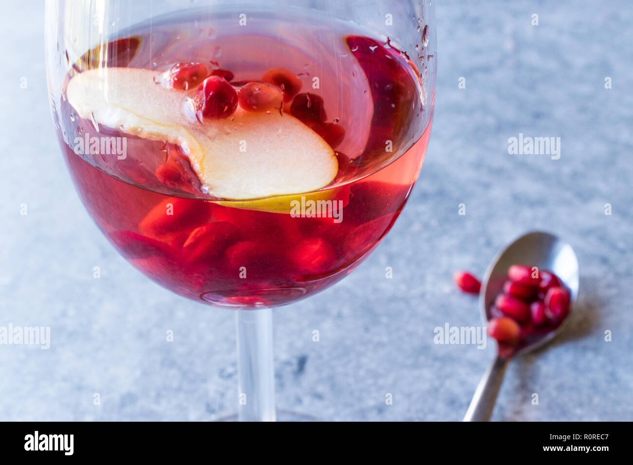 Rose Pink Blush Wine Cocktail with Pomegranate Seeds, Apple Slice and