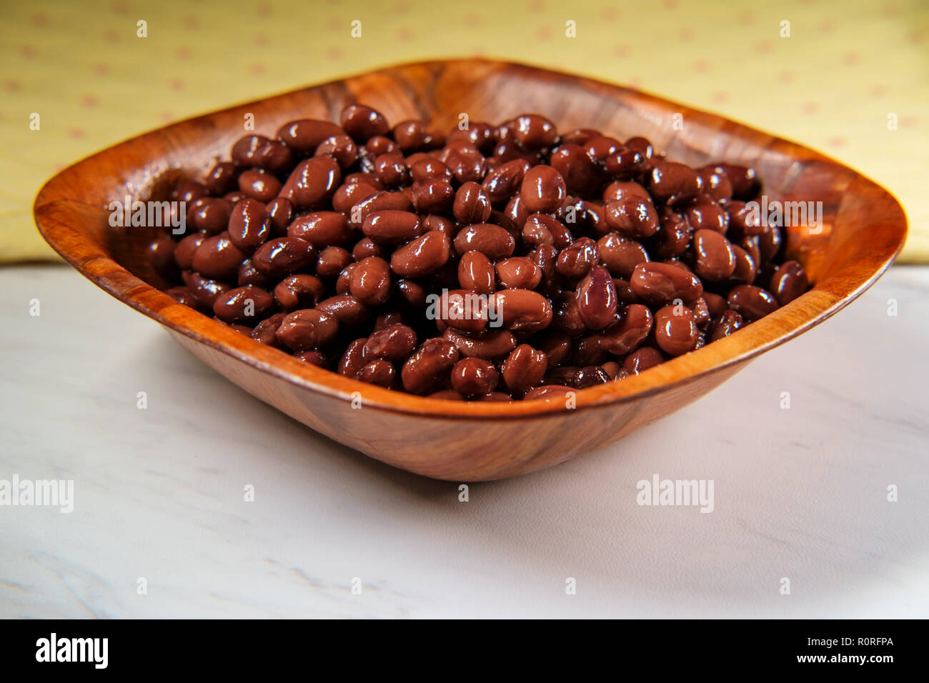 Chili ingredients wooden bowl black turtle beans on marble counter