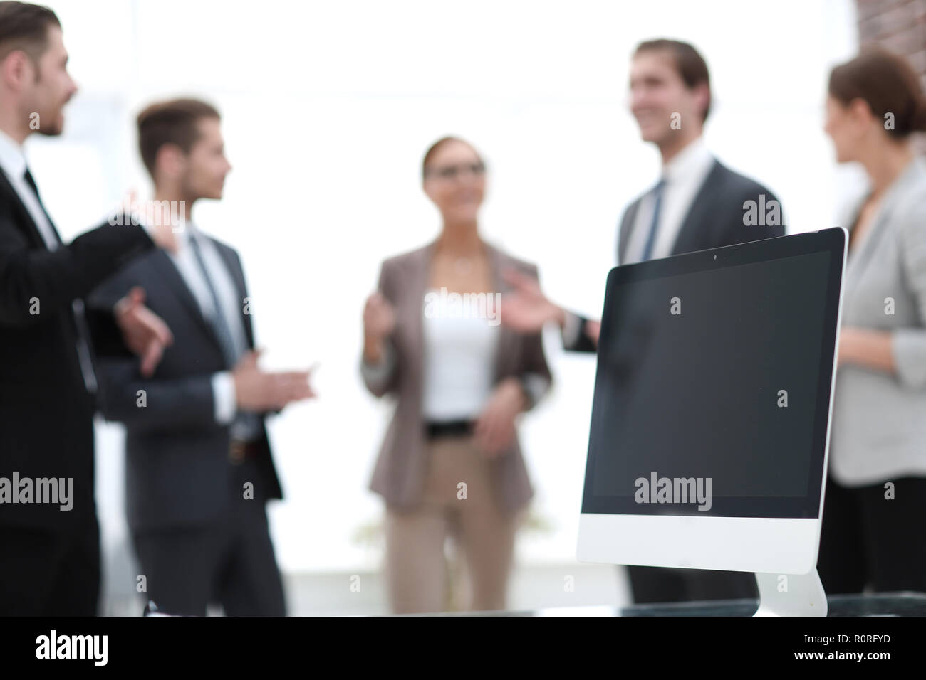 business team standing in the office hallway Stock Photo - Alamy