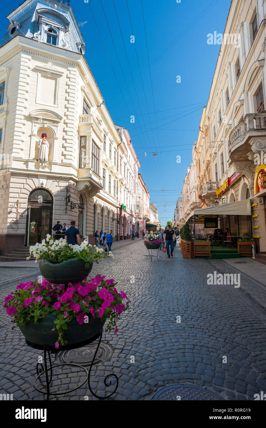 Pedestrians on Olha Kobylyahska Street in Chernivtsi, a superb example of Austro-Hungarian Empire architecture in western Ukraine. Stock Photo
